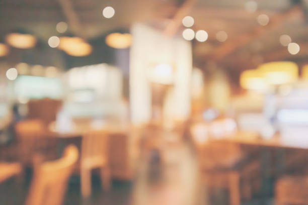 istock Restaurant interior with customer and wood table blur abstract background with bokeh light 1064371176