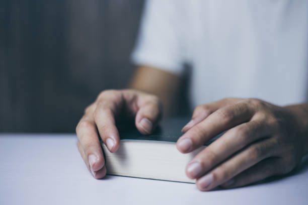 istock Holding The Holy Bible 1064374572