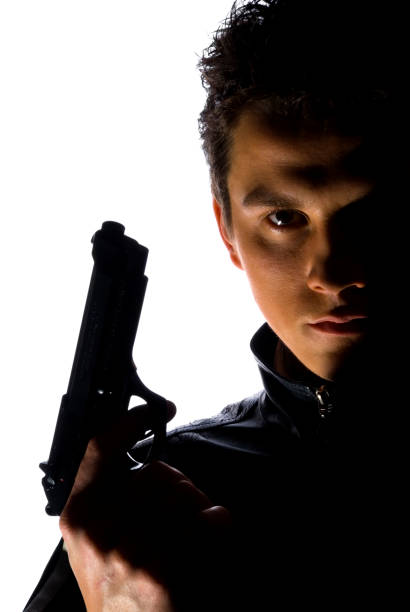 istock Young man portrait with gun 106438098