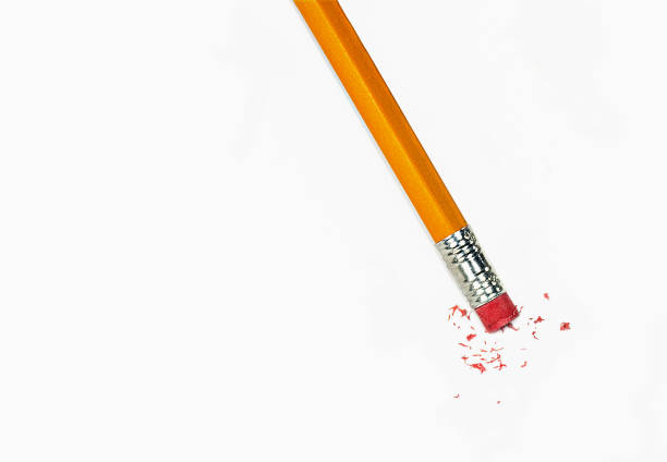 istock yellow pencil erasing on paper 1064381810