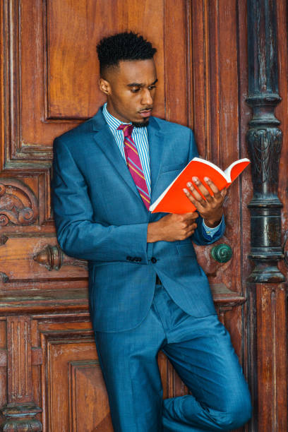 Young African American Man with beard working, studying in New York
