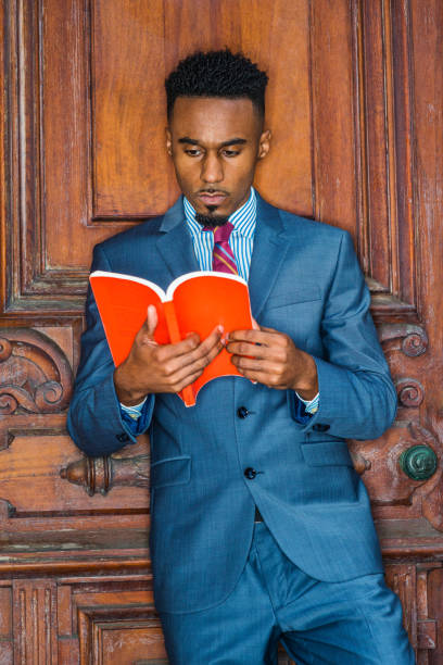 istock Young African American Man with beard working, studying in New York 1064403058