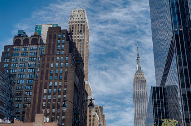 istock Buildings of Manhattan and cloudy sky 1064407906