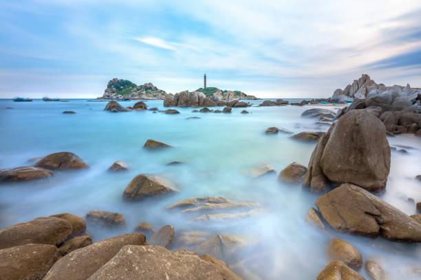 istock Ke Ga Lighthouse sunset with surf patted smoother reefs create clouds on the sea 1064408052
