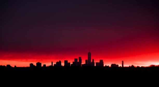 istock Manhattan Buildings skyline in a red Sunset 1064408062