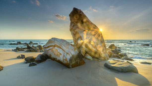 istock Sunrise ancient fossil reef as radiating star rounded up right edge large rock 1064408396