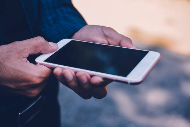 istock Businessman holding smart phone and using  internet online 1064408626