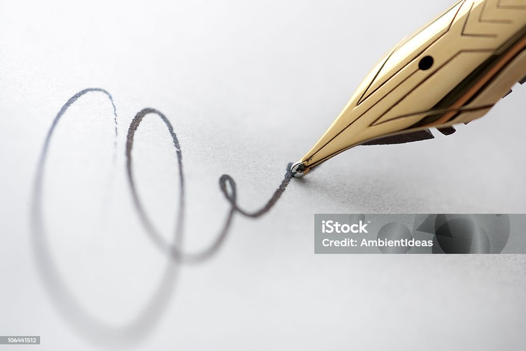 Gold pen with signature  Fountain Pen Stock Photo