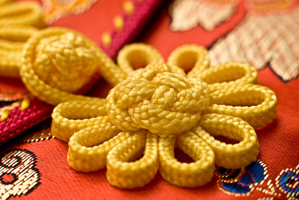 Yellow crochet lace on a white background.