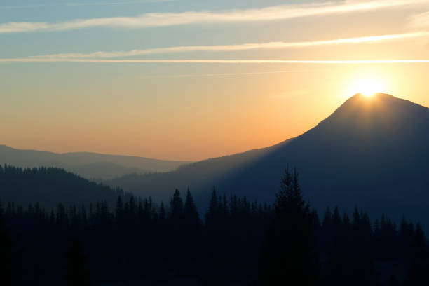 juicy sunrise on top of a mountain