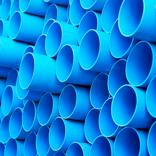 istock Blue PVC pipes stacked in construction site 1064422918