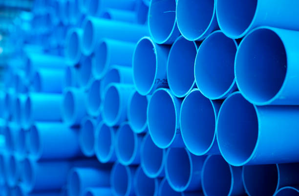 istock Blue PVC pipes stacked in construction site 1064422920
