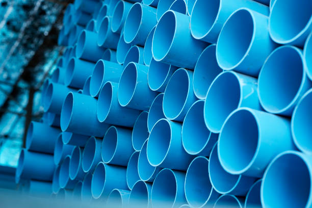 istock Blue PVC pipes stacked in construction site 1064422936