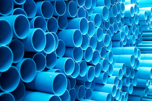 istock Blue PVC pipes stacked in construction site 1064422958