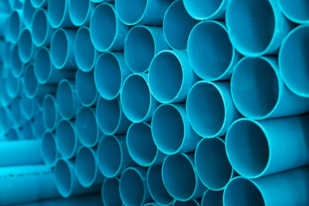istock Blue PVC pipes stacked in construction site 1064422960