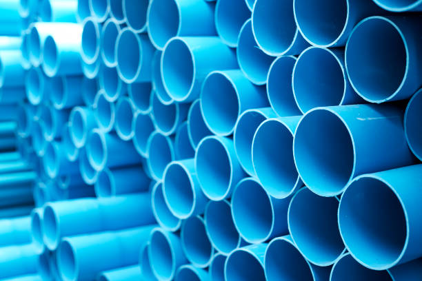 istock Blue PVC pipes stacked in construction site 1064422990
