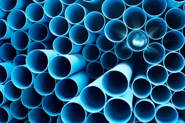 istock Blue PVC pipes stacked in construction site 1064423078
