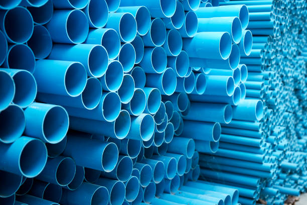 istock Blue PVC pipes stacked in construction site 1064423092