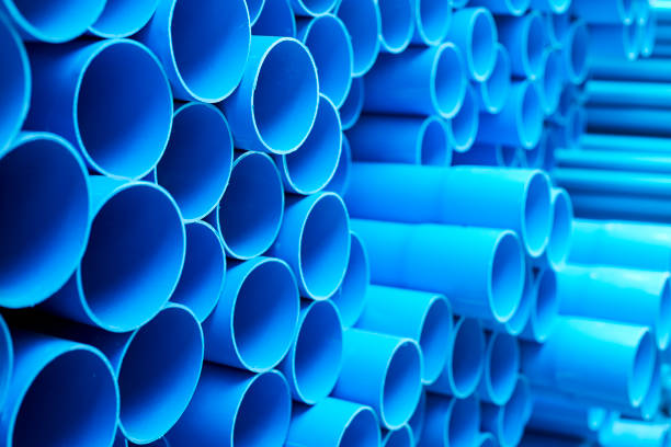 istock Blue PVC pipes stacked in construction site 1064423098