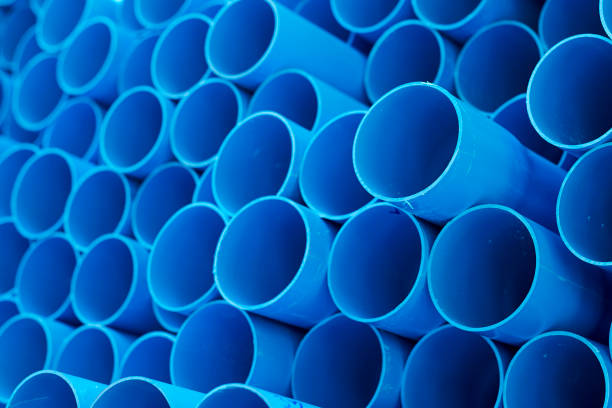 istock Blue PVC pipes stacked in construction site 1064423222