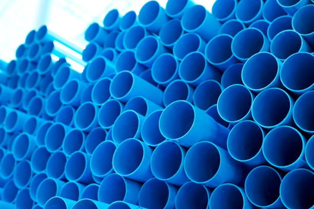 istock Blue PVC pipes stacked in construction site 1064423240
