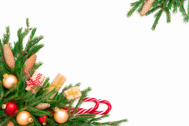 istock Christmas frame composition with gift box, pine cones, fir tree branches, isolated. Flat lay, top view, copy space 1064433362