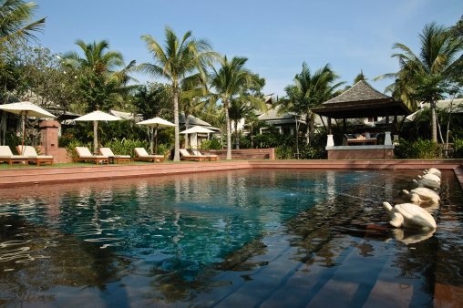 Outdoor swimming pool at resort on sunny day