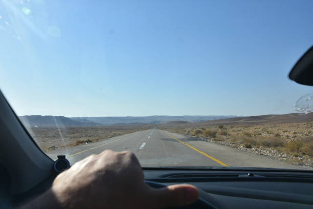 istock A driver's point of view on a desert trip 1064433640