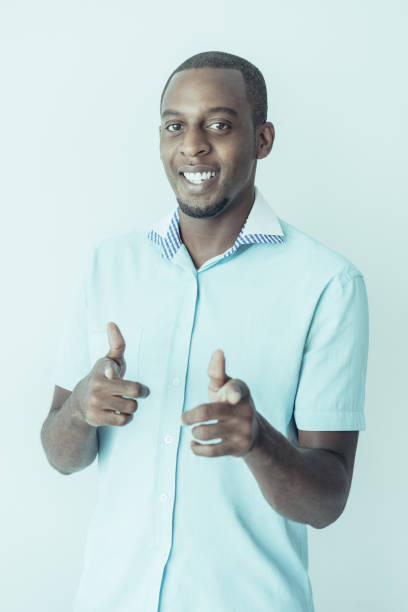 istock Happy optimistic African man making finger guns 1064433810