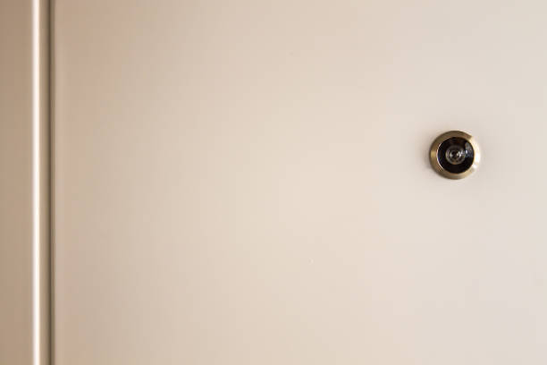 istock CCTV Camera Circle Small Black Installed with cream colored walls. For security surveillance 1064442482