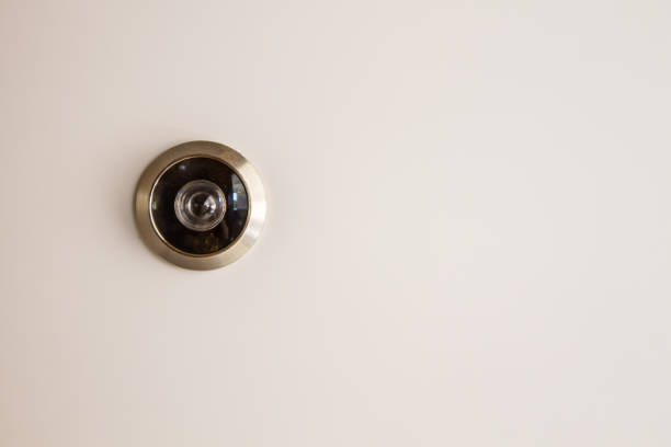 CCTV Camera Circle Small Black Installed with cream colored walls. For security surveillance