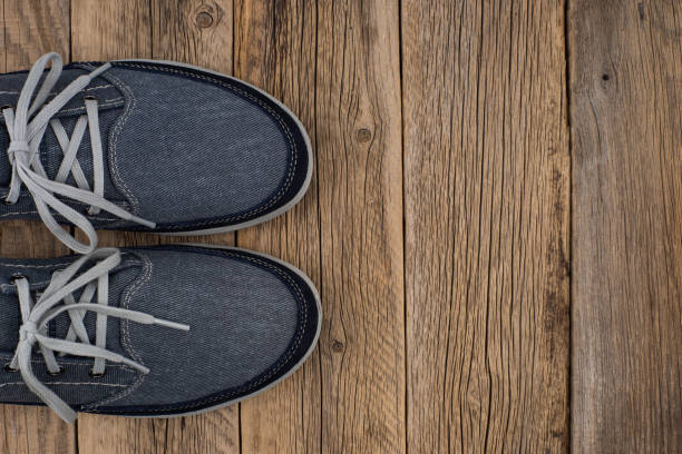 istock Blue Sneakers with wooden background. Top view. 1064442568