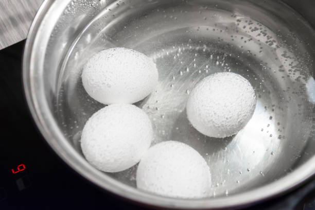 istock Cooking white chicken eggs in a saucepan. 1064442760