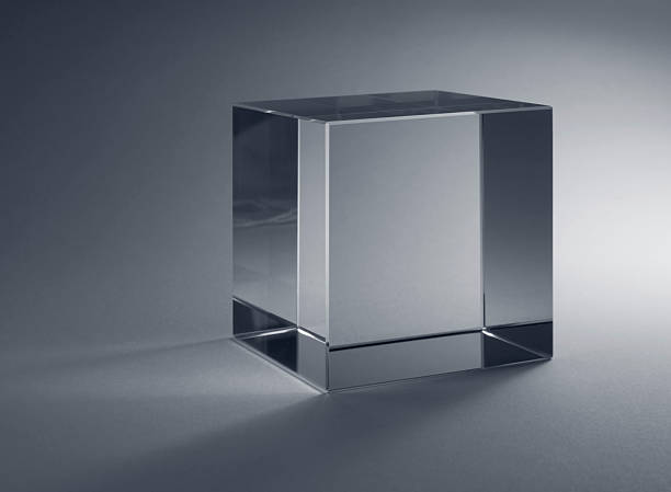 solid glass cube studio photography of a solid glass cube in grey back refraction photos stock pictures, royalty-free photos & images