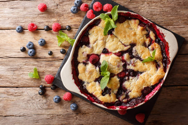 istock Summer berry cake with raspberry berries, currants and blueberries close-up in a baking dish. Horizontal top view 1064446860