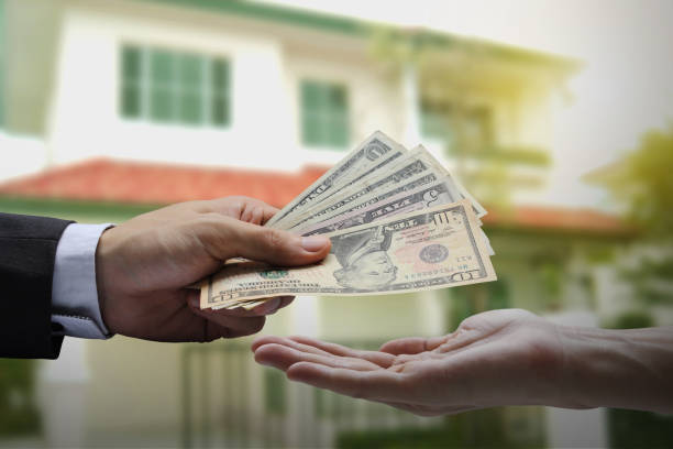 istock Pay the US dollar , Hand use dollar money. 1064447146