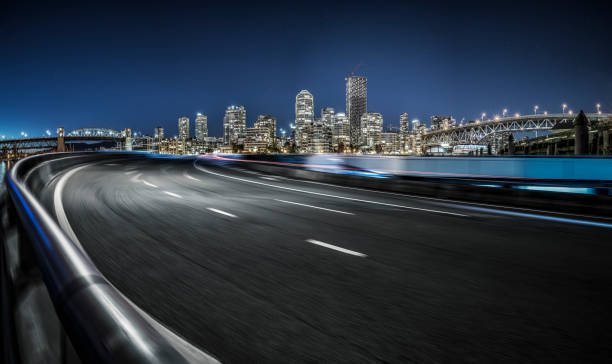 motion blur road towards Vancouver downtown motion blur road towards Vancouver downtown,Vancouver,British Columbia, Canada. night freeway stock pictures, royalty-free photos & images