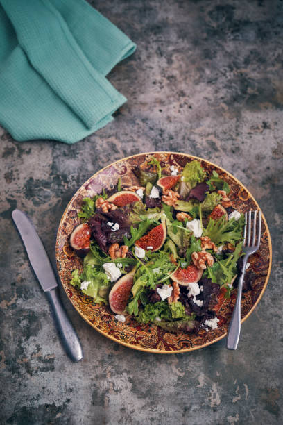 istock Arugula Fig Salad with Walnuts and Feta Cheese 1064454004
