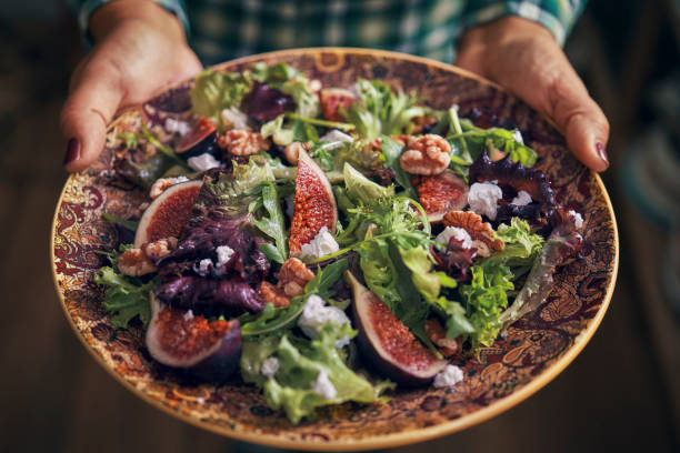 Arugula Fig Salad with Walnuts and Feta Cheese Arugula Fig Salad with Walnuts and Feta Cheese greek food stock pictures, royalty-free photos & images