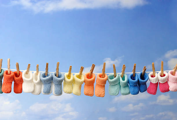 istock concept: baby booties in a row on clothes line 106445441