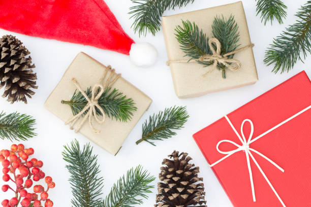istock Top view of Christmas composition, gift box, pine cones, fir branches on white background 1064455824