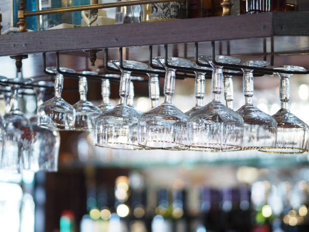 istock Mini Bar Glass hanging on brass rail. 1064461046