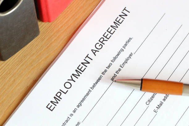 istock Blank form of an employment agreement on a desk 1064462582