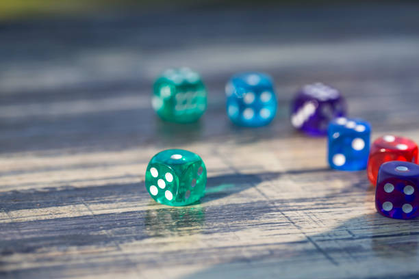 istock colorful dice isolated on wooden table 1064467762