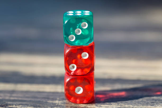 istock colorful dice isolated on wooden table 1064467768