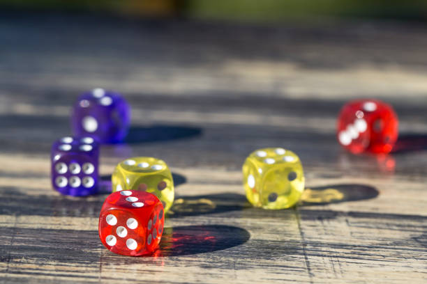 istock colorful dice isolated on wooden table 1064467806