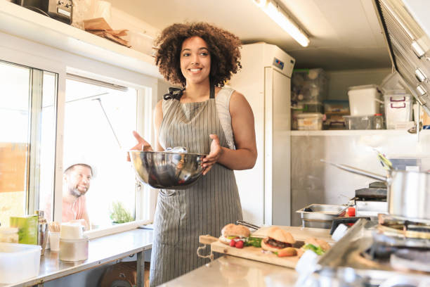 istock Attractive Afro female fast food worker 1064469466