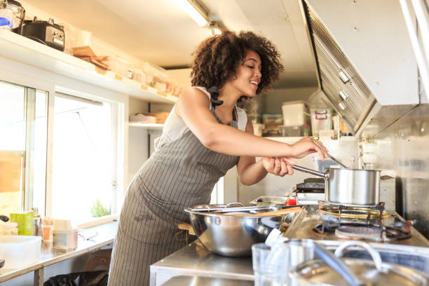 istock Attractive Afro female fast food worker 1064469546
