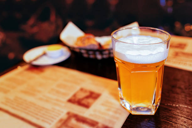 istock Glass of beer on table in pub 1064470064