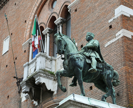 equestrian statue on the municipal palace of the city of Ferrara in Italy
